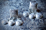 Vintage Handmade Silver Square Post Earrings with Triple Spiral Disks